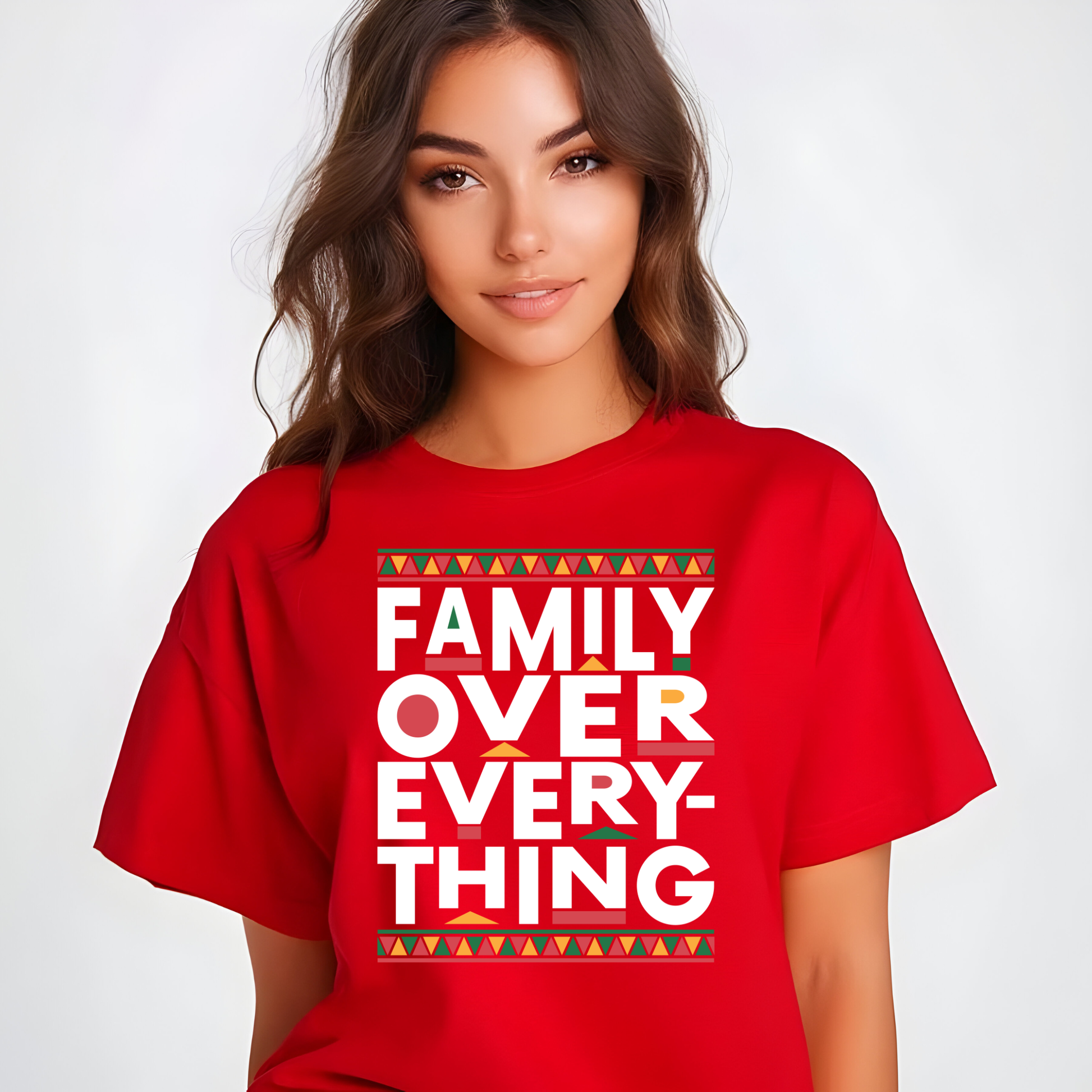 Person wearing a red t-shirt with 'Family Over Everything' text on a plain background