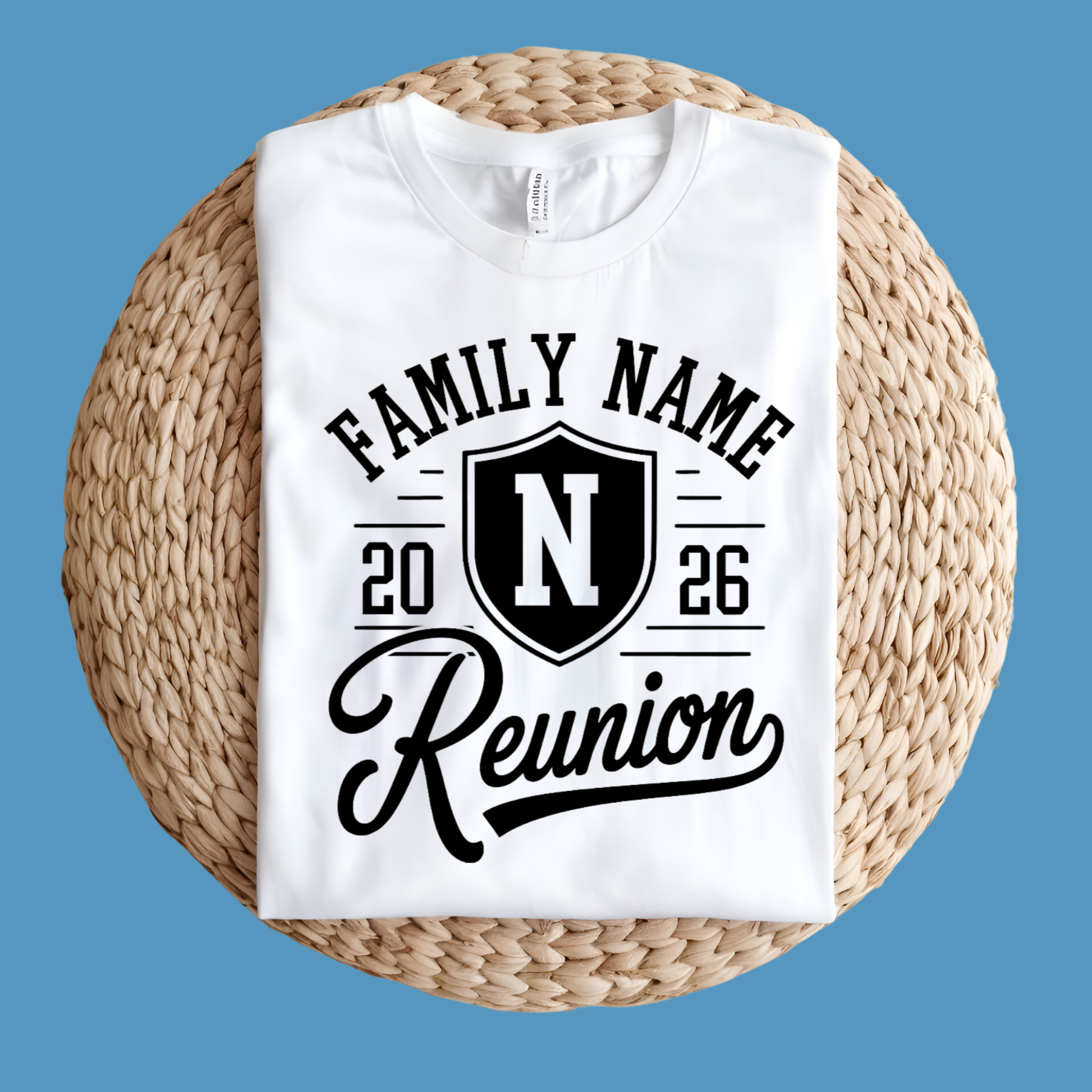 White t-shirt with black text and design on a woven surface against a blue background
