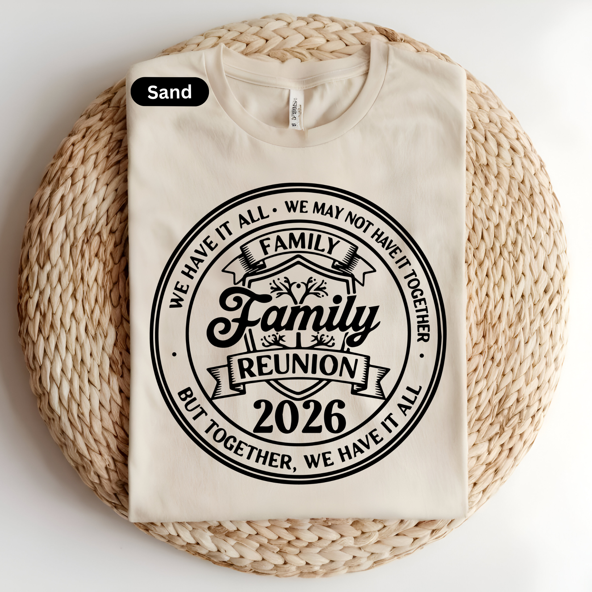 Beige t-shirt with 'Family Reunion 2026' text on a woven surface