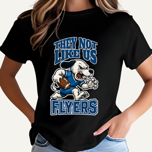 Black t-shirt with a graphic design and text, worn by a person. Flyers Mascot T-Shirt: "They Not Like Us" Flyers Game Day Graphic Tee