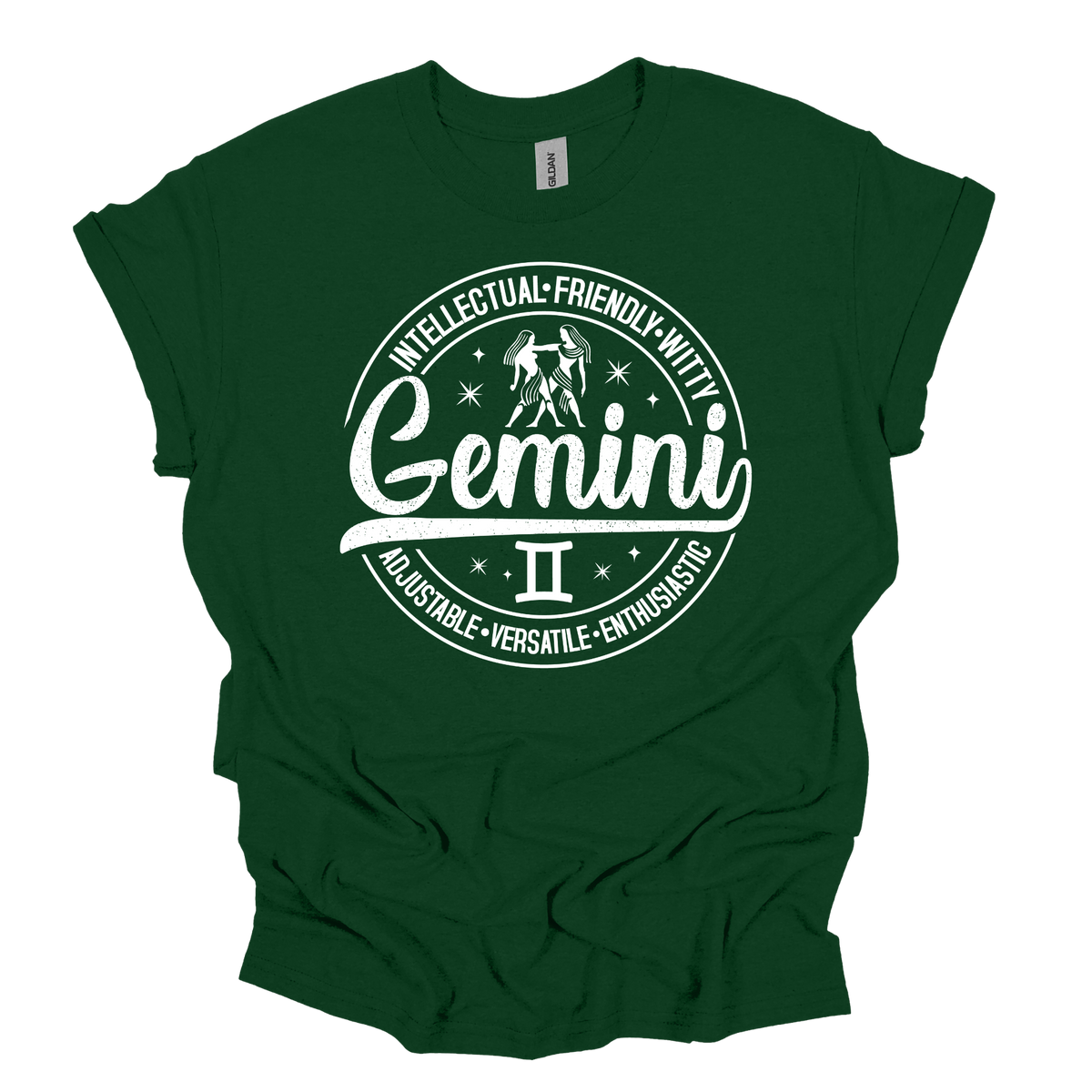 Forest green t-shirt laid flat, featuring a circular white Gemini zodiac graphic with the twins illustration, the word "Gemini," and trait keywords like intellectual, friendly, witty, enthusiastic, versatile, and adjustable.