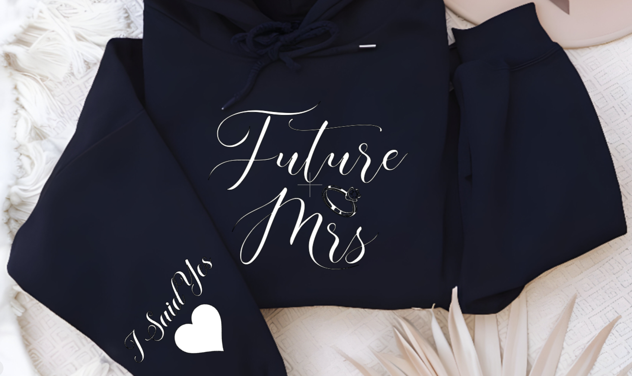 Women's navy hoodie with Future Mrs. to indicate engagement Announcement keepsake sweater for the bride to be in addition to a perfect engagement gift at the bridal, a personalized wedding shirt with I said yes on the sleeve