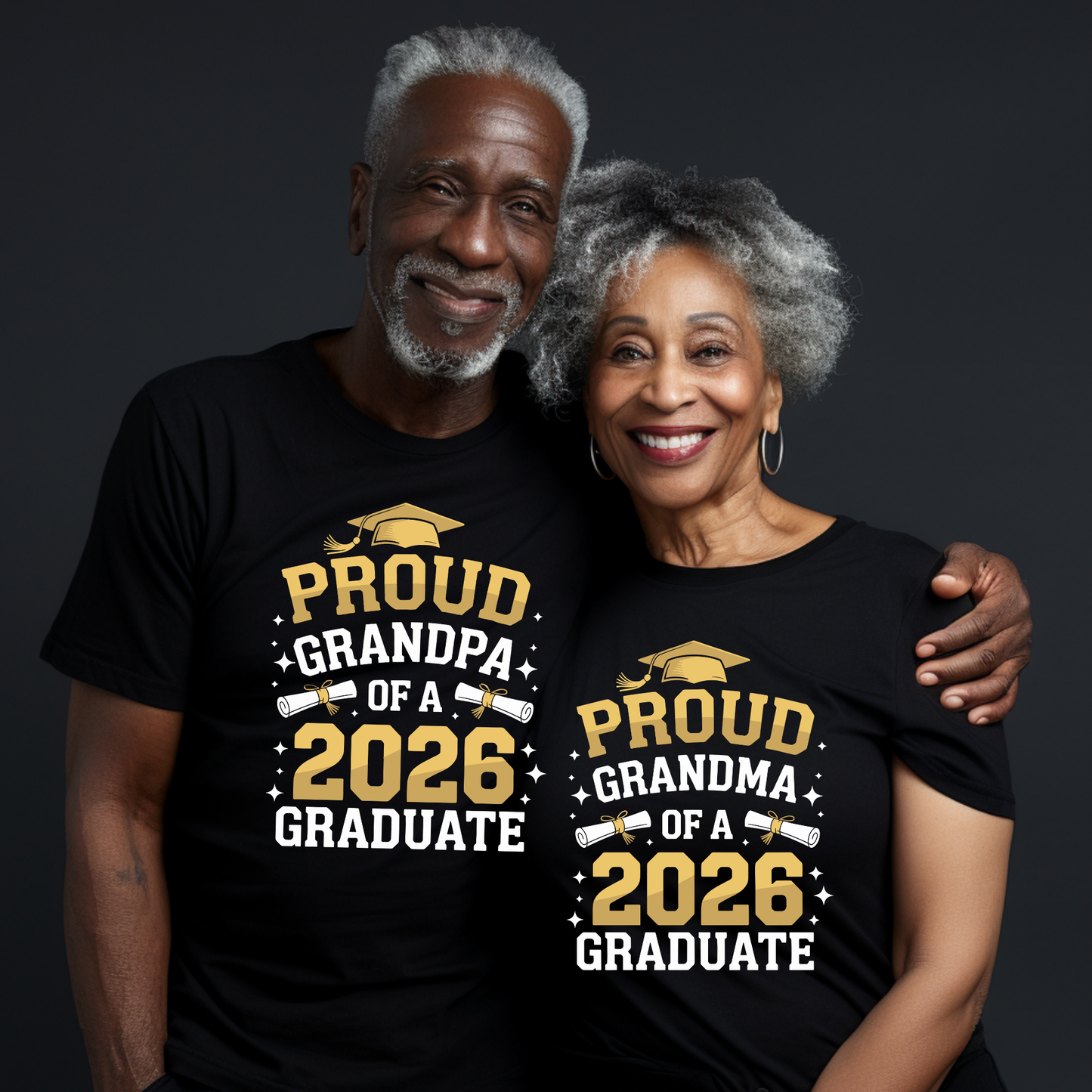 Two people wearing black t-shirts with 'Proud Grandpa of a 2026 Graduate' and 'Proud Grandma of a 2026 Graduate' text.