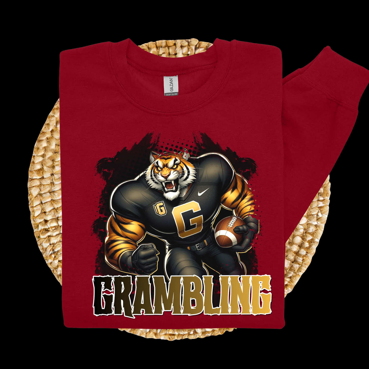 Red t-shirt with a tiger graphic and 'Grambling' text on a woven surface
