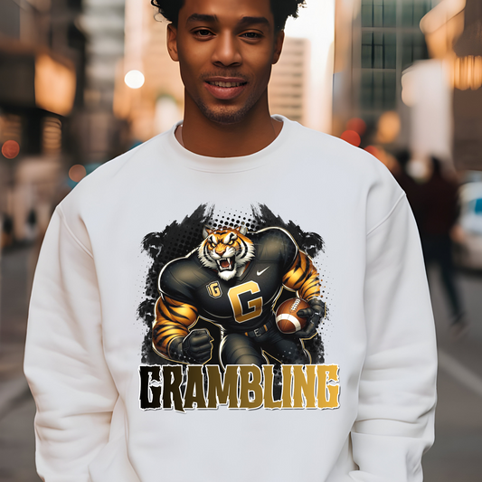 Person wearing a white sweatshirt with a tiger graphic and 'Grambling' text on a city street background