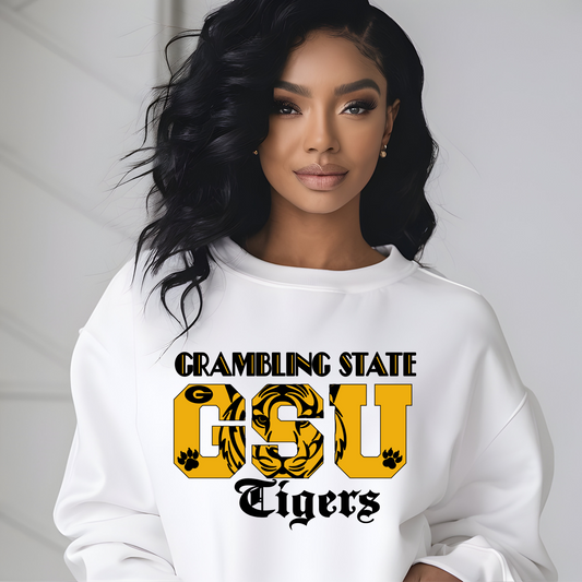 Woman wearing a white sweatshirt with 'Crambling State GSU Tigers' text and logo. GSU Tigers Sweatshirt: HBCU Game Day Football Cozy Sweater