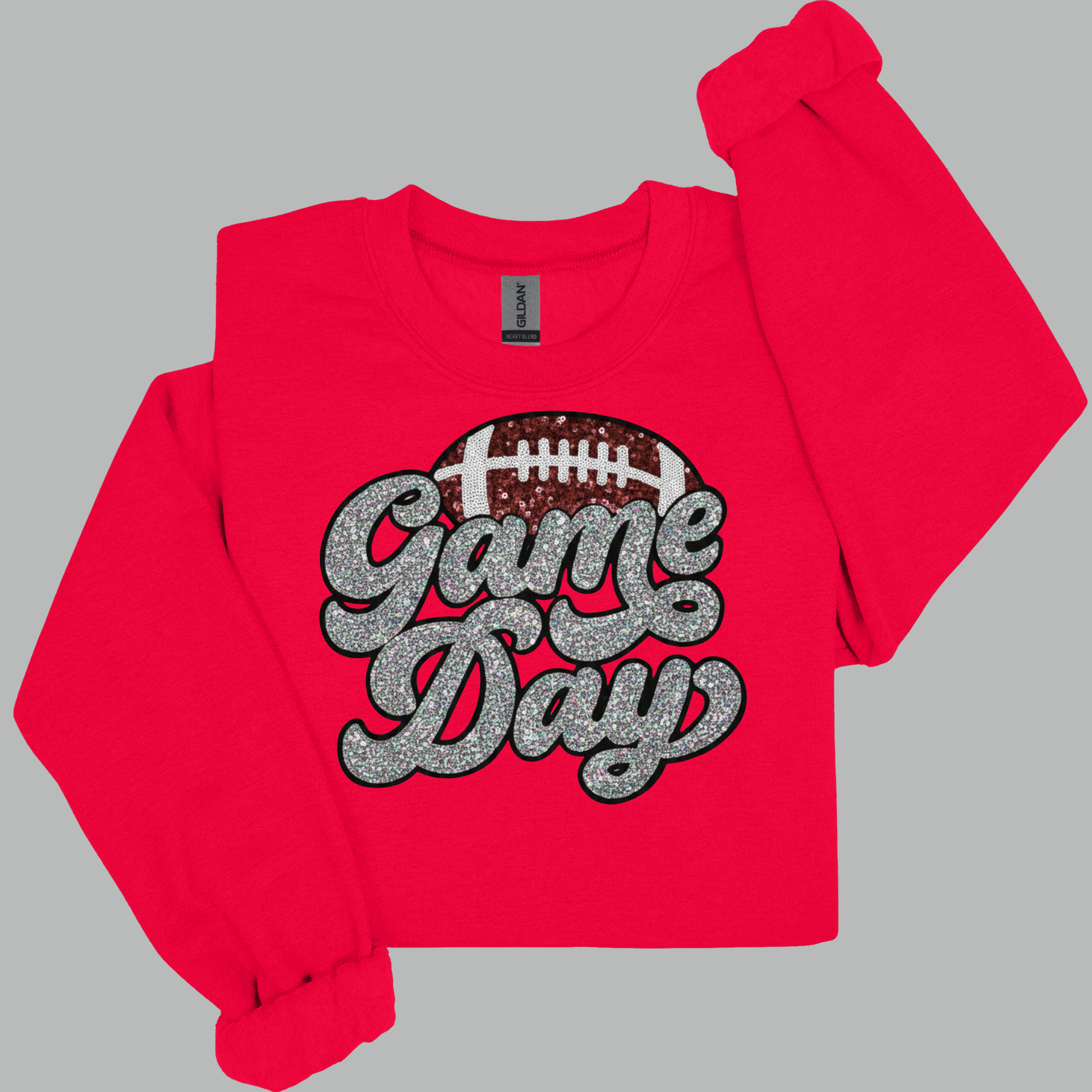 Red long-sleeve shirt with 'Game Day' and football graphic on a gray background