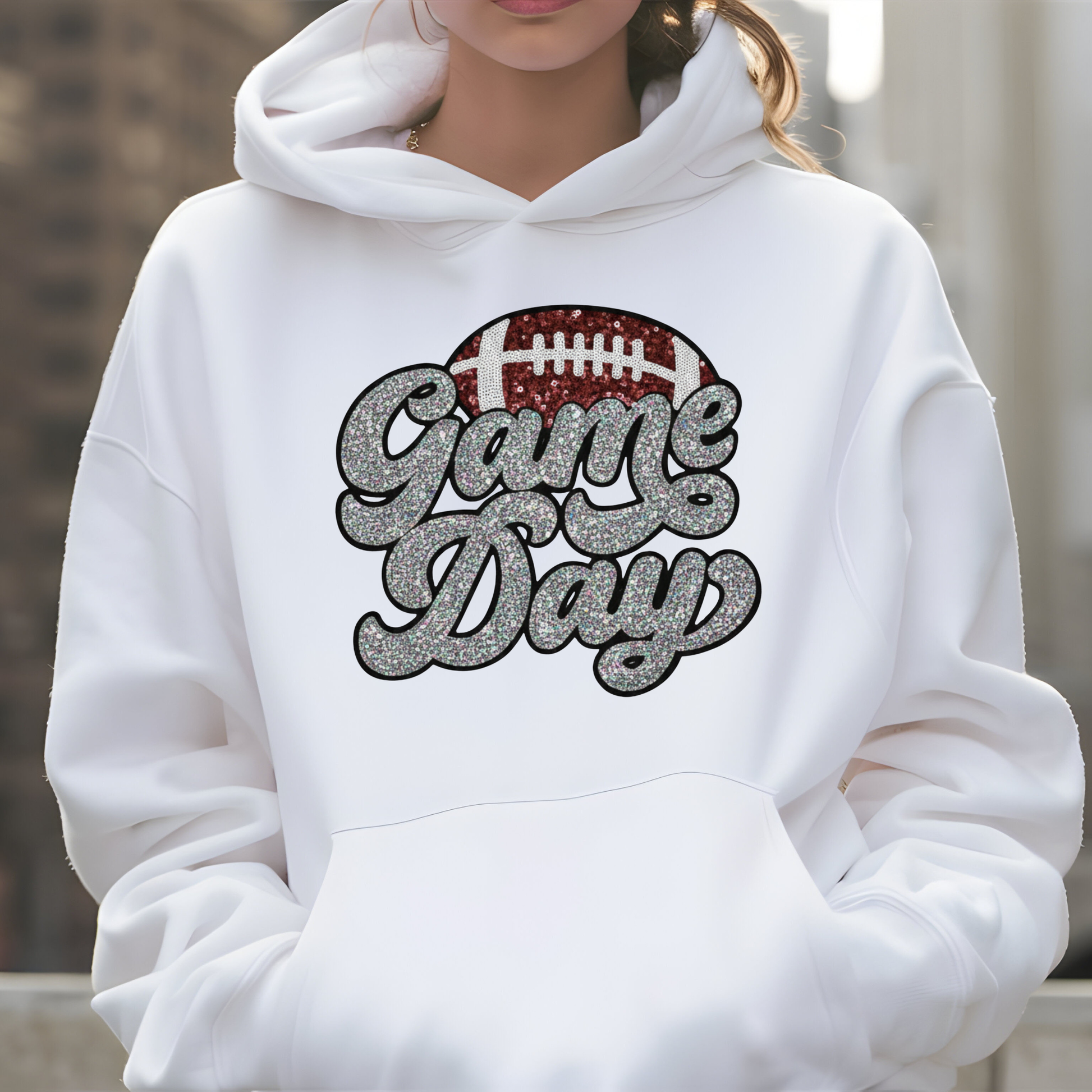 White hoodie with 'Game Day' and football graphic