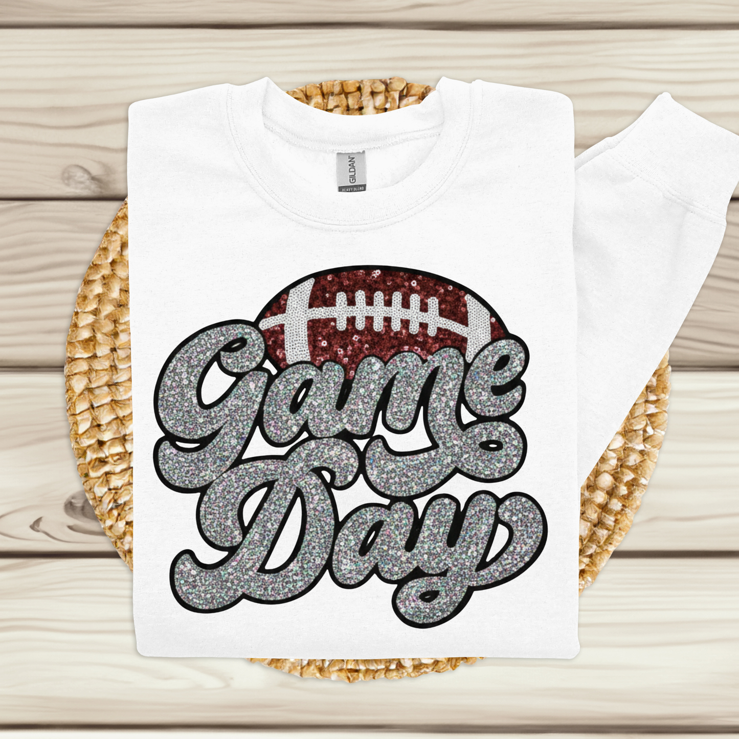 White t-shirt with 'Game Day' and football graphic on a woven mat