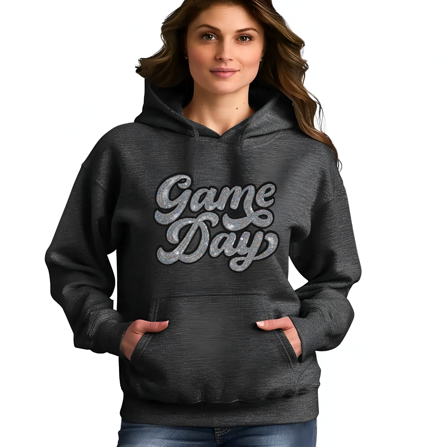 Person wearing a dark gray hoodie with 'Game Day' text on a plain background