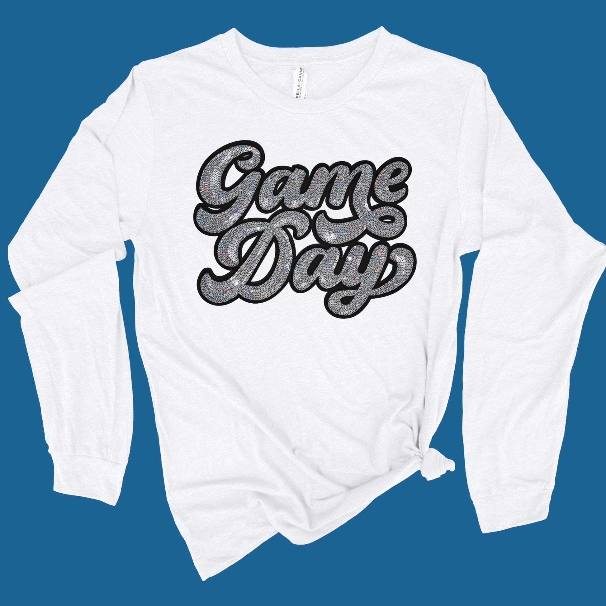 White sweatshirt with 'Game Day' text on a blue background