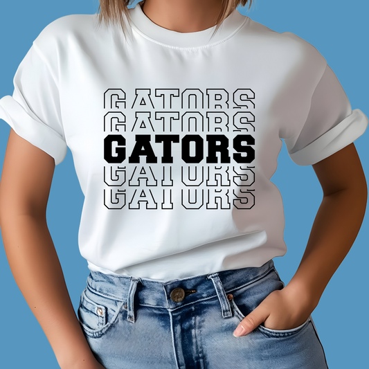 Person wearing a white t-shirt with 'GATORS' text design on a blue background  Gators Mascot Shirt - Gators Pride Game Day Ready Cool Tee