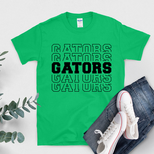Green t-shirt with 'GATORS' text, white sneakers, and jeans on a light gray background  Gators Mascot Shirt - Gators Pride Game Day Ready Cool Tee