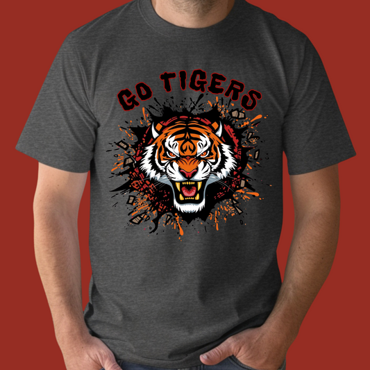 Person wearing a dark gray t-shirt with a tiger graphic and 'Go Tigers' text on a red background  Go Tigers Bold Mascot Tee – Unleash Your School Spirit