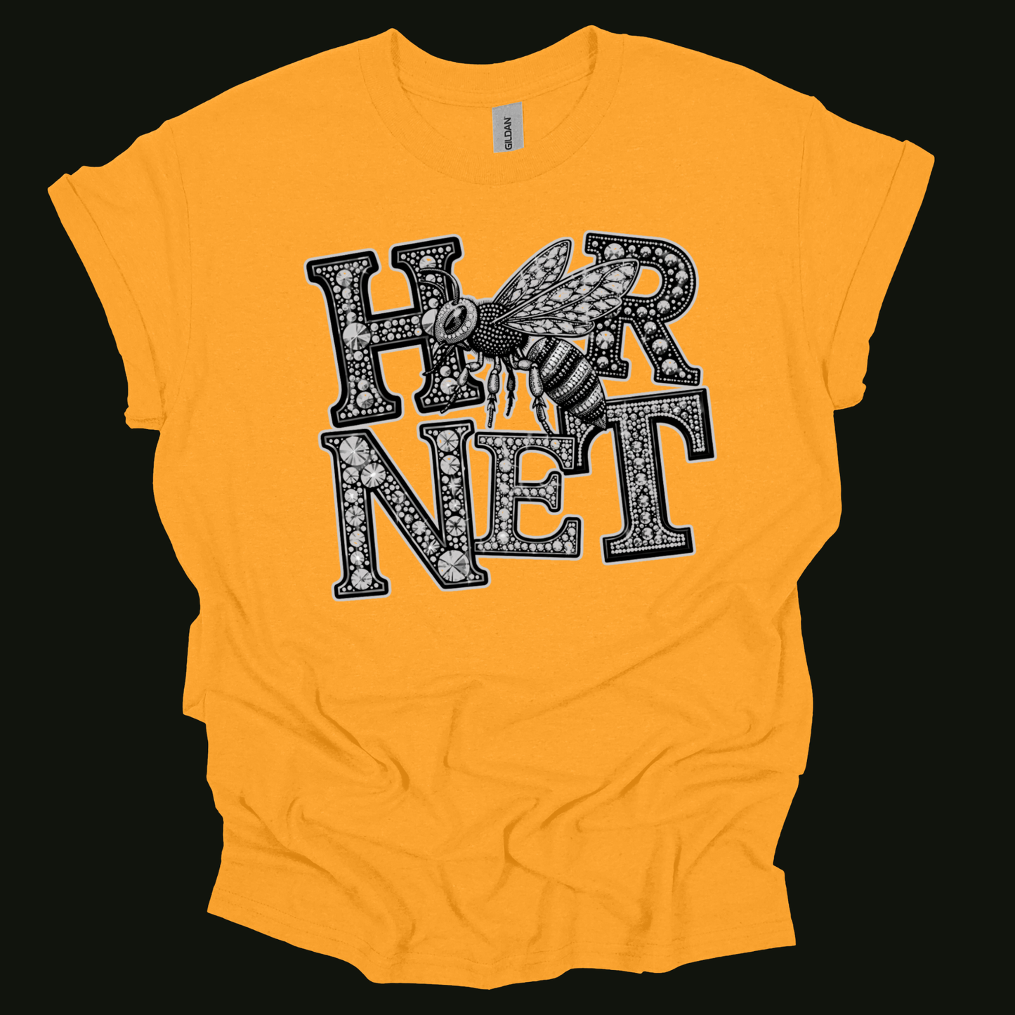 A bright yellow short-sleeve t-shirt with a graphic print of an eagle head and the word 'EAGLES' in a black and white dotted font, laid flat on a black background.