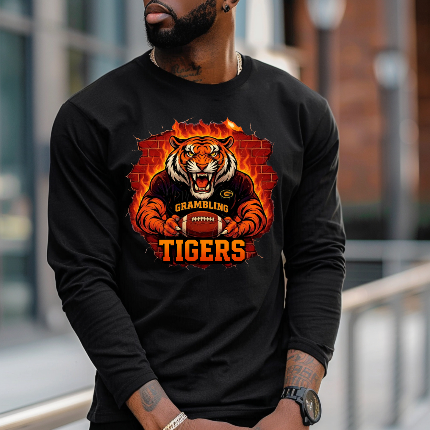 Person wearing a black long-sleeve shirt with a tiger graphic and 'Grambling Tigers' text.