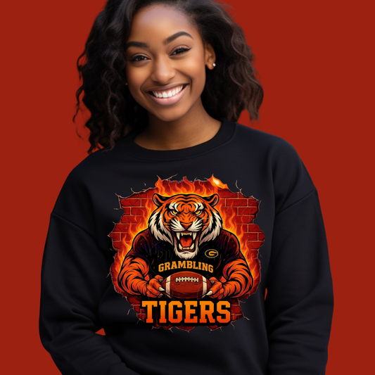 Person wearing a black sweatshirt with a tiger graphic and 'Grambling Tigers' text on a red background