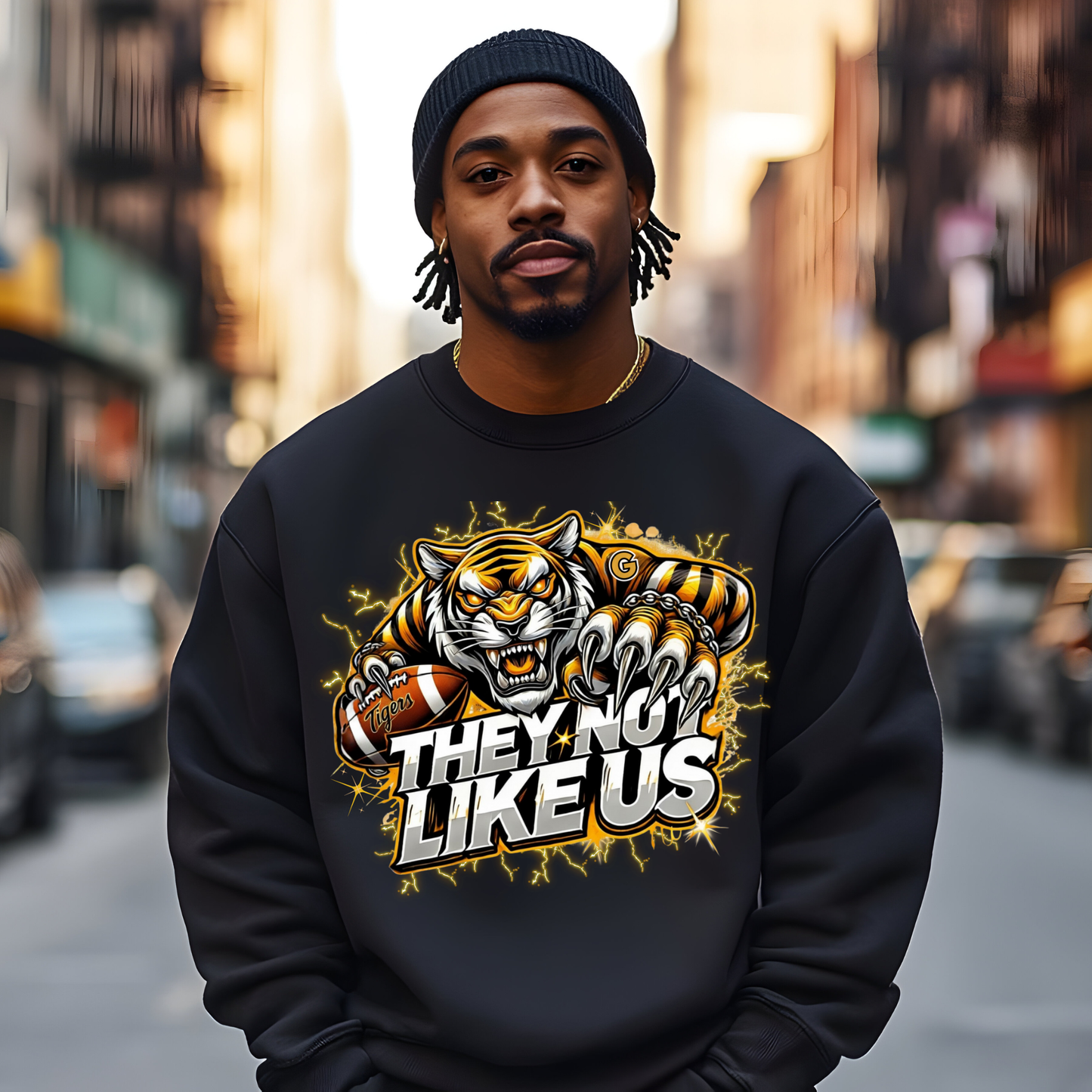 Man wearing a black sweatshirt with a tiger graphic and text on a city street background