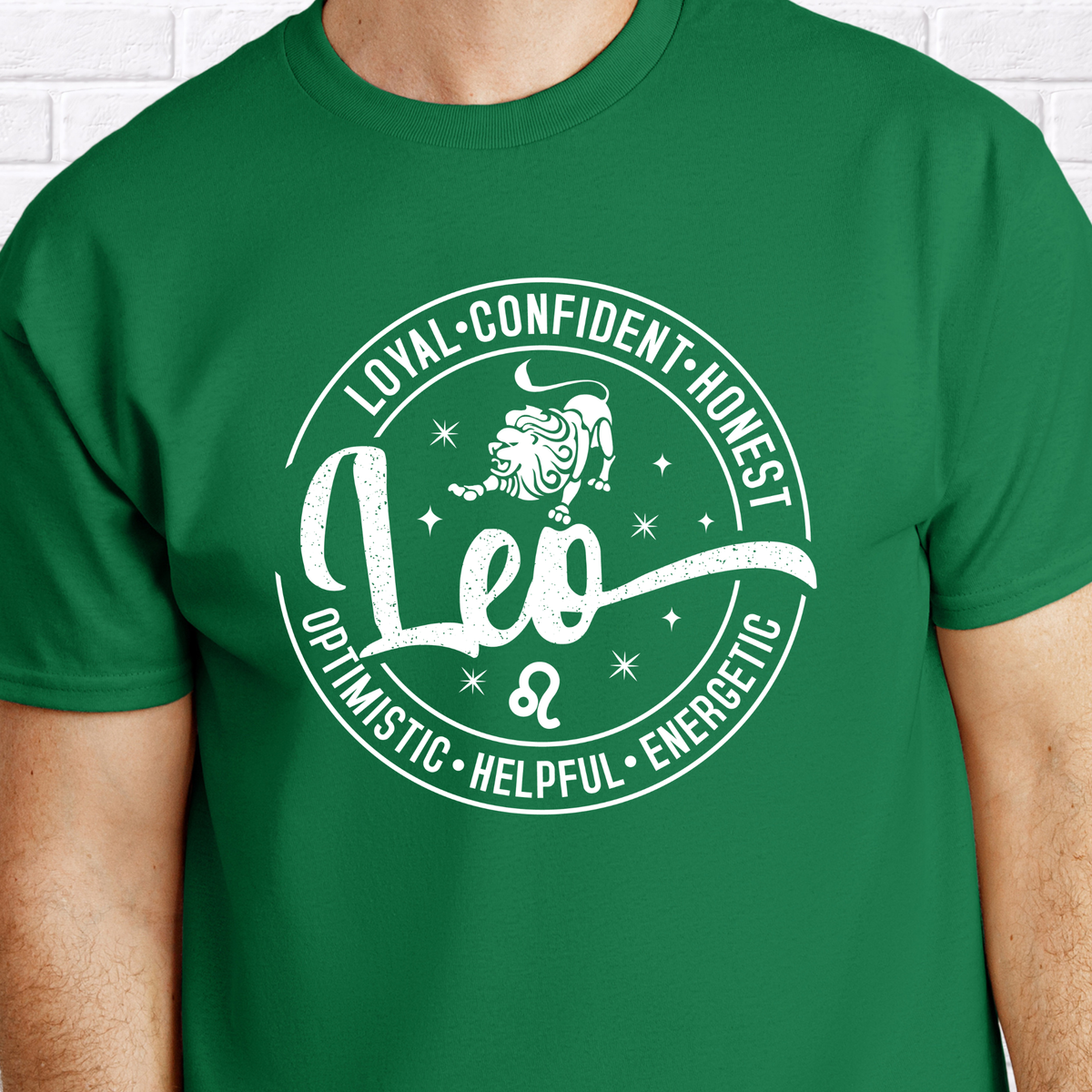 Woman wearing a vibrant green Leo zodiac t-shirt featuring a white round graphic with a lion illustration, the word "Leo," and positive trait keywords like loyal, confident, honest, energetic, helpful, and optimistic.