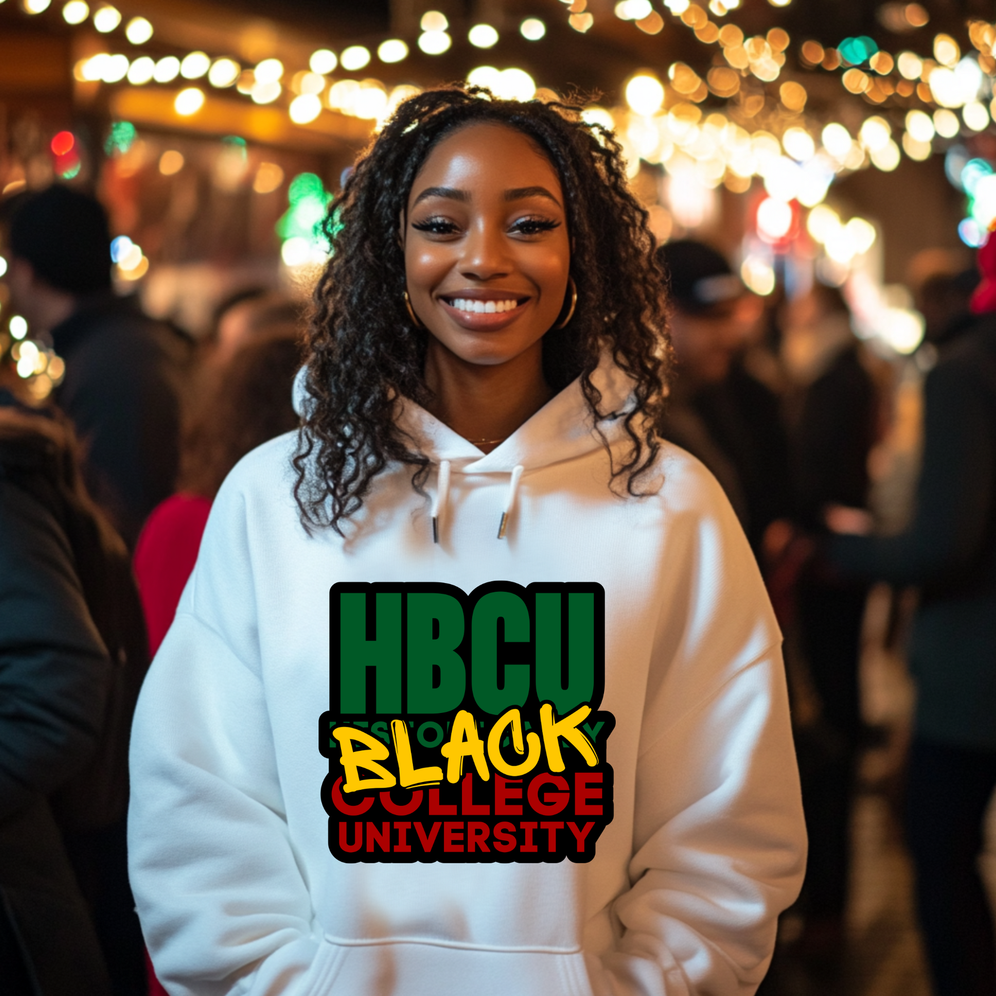 Person wearing a white hoodie with 'HBCU Black College University' text in a festive outdoor setting.