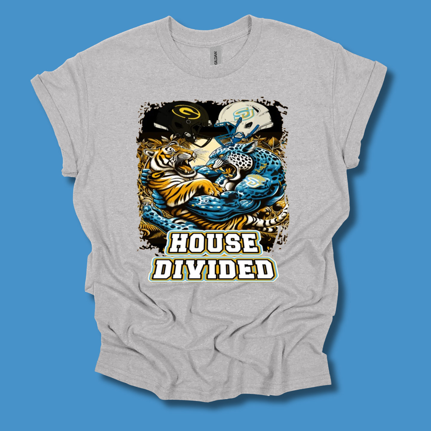 A light heather gray t-shirt with a graphic print of a tiger and a blue jaguar with the text 'HOUSE DIVIDED' underneath, displayed against a solid blue background.