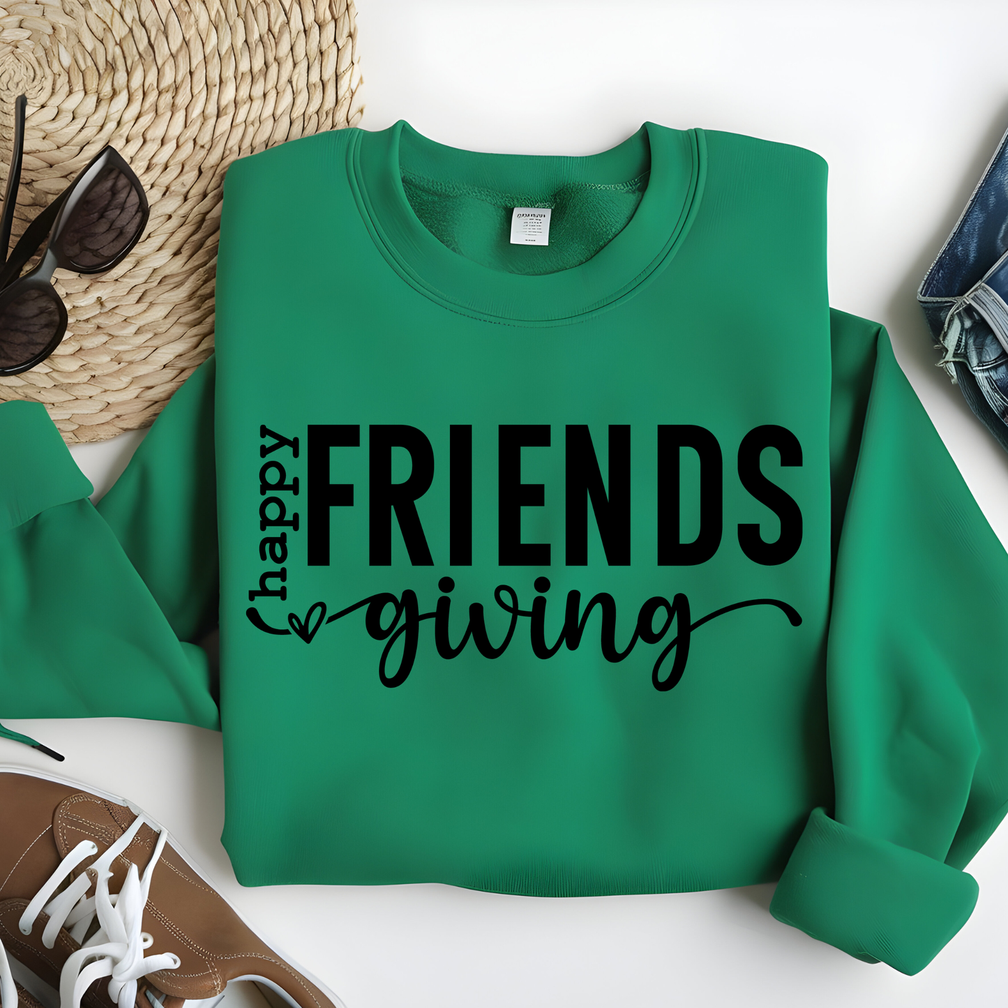 Green sweatshirt with 'happy FRIENDS giving' text on a white background