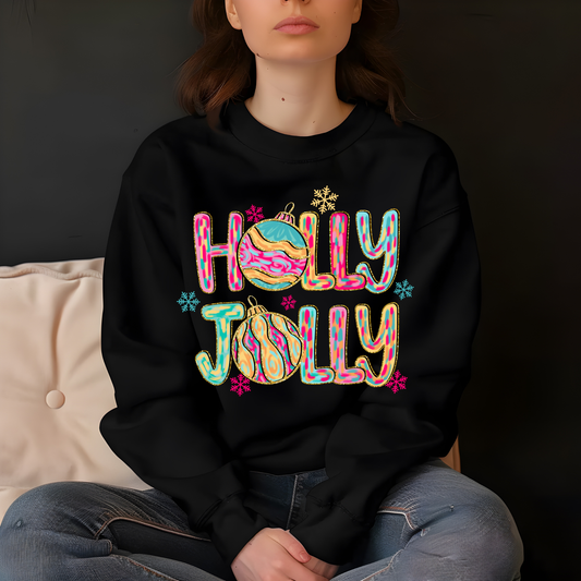 Person wearing a black sweatshirt with 'Holly Jolly' design sitting on a couch.