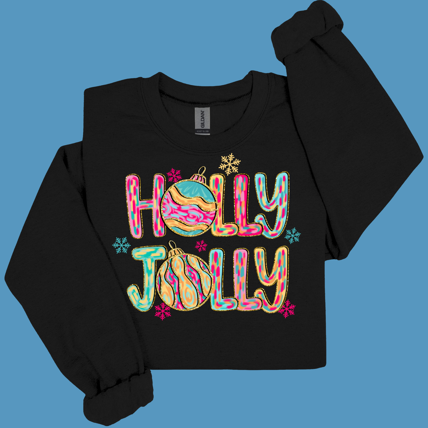 Black long-sleeve shirt with 'Holly Jolly' text and Christmas graphics on a blue background