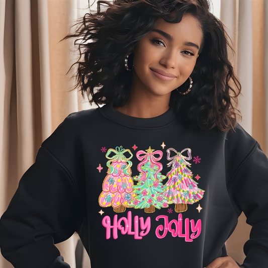 Person wearing a black sweatshirt with colorful Christmas tree design and 'Holly Jolly' text.