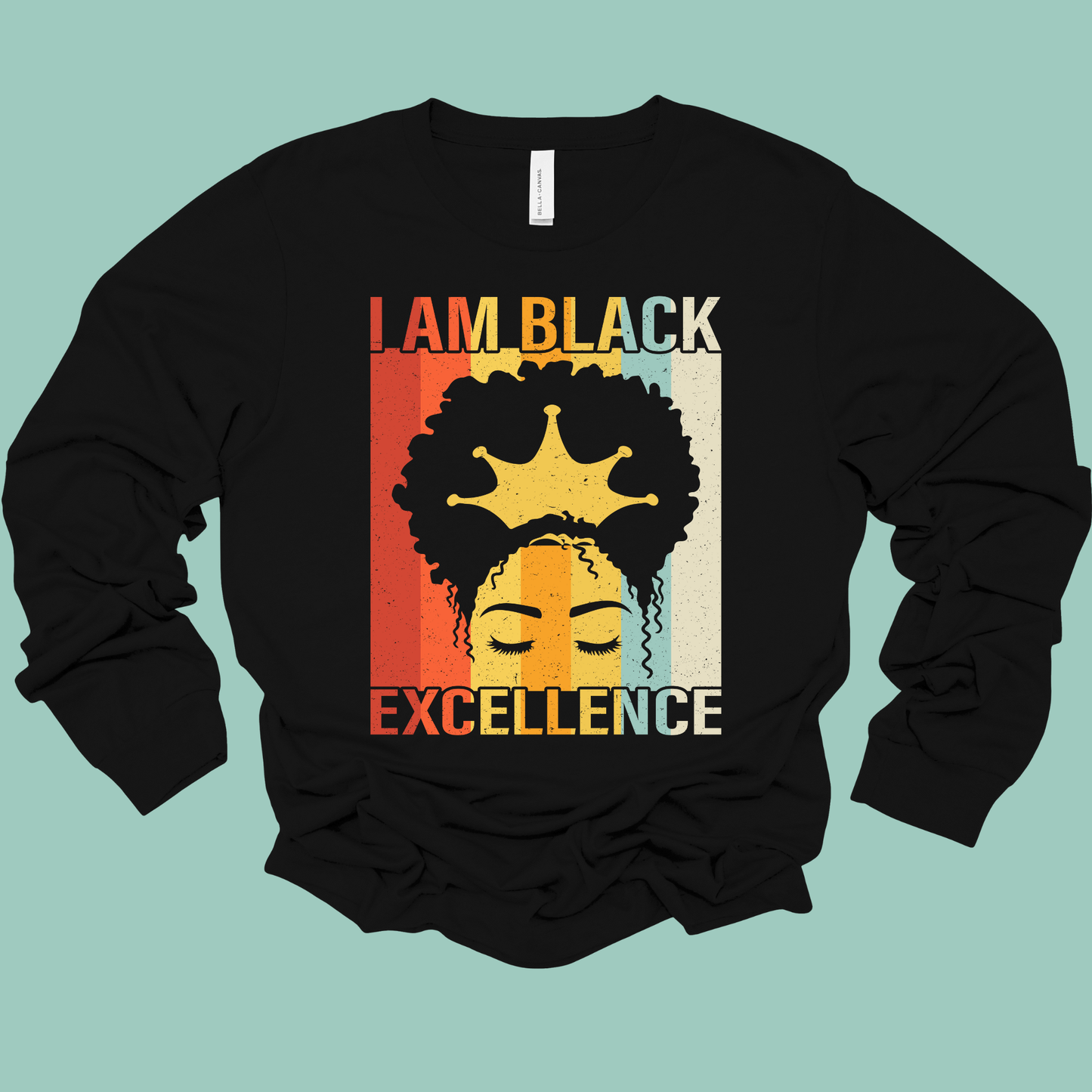 Black long-sleeve shirt with 'I AM BLACK EXCELLENCE' text and graphic on a light blue background