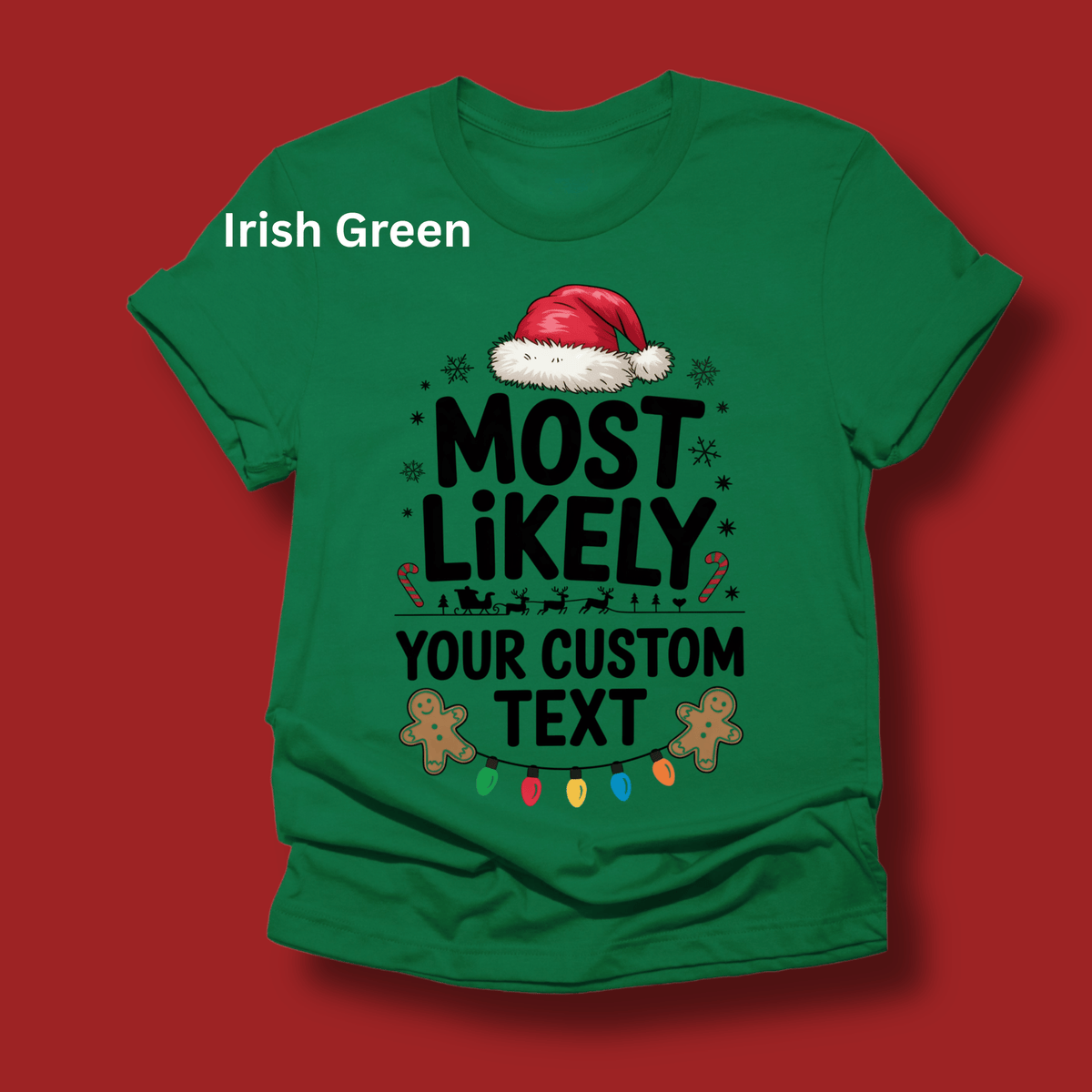A green short-sleeve t-shirt with a Christmas-themed graphic print reading 'MOST LIKELY YOUR CUSTOM TEXT' with a Santa hat, candy canes, gingerbread men, and colorful lights, shown on a solid red background with 'Irish Green' text overlay.