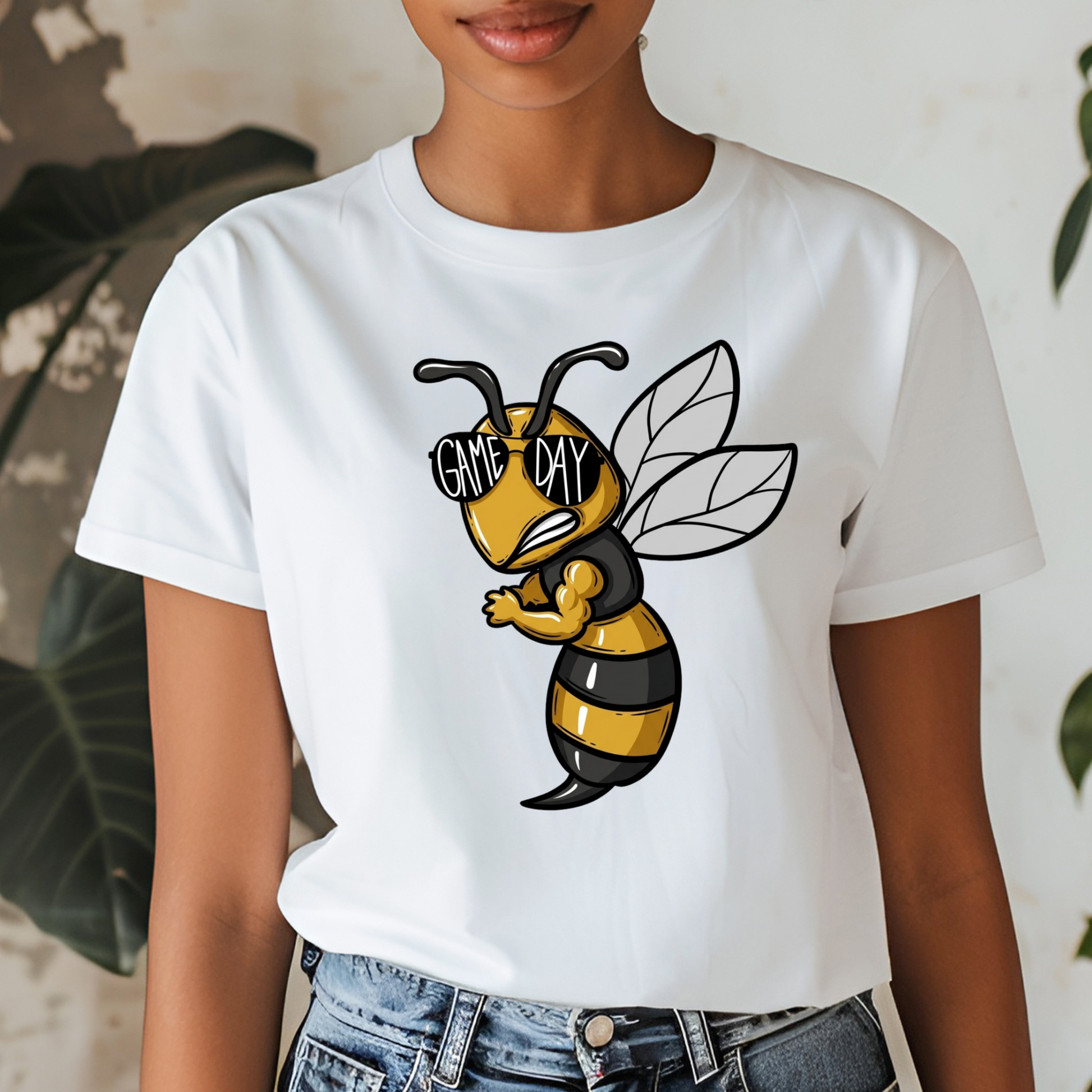A white short-sleeve graphic t-shirt worn by a model, featuring a cartoon bee wearing black sunglasses with the text 'GAME MY'.