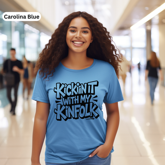 Woman wearing a blue t-shirt with text in a modern indoor setting