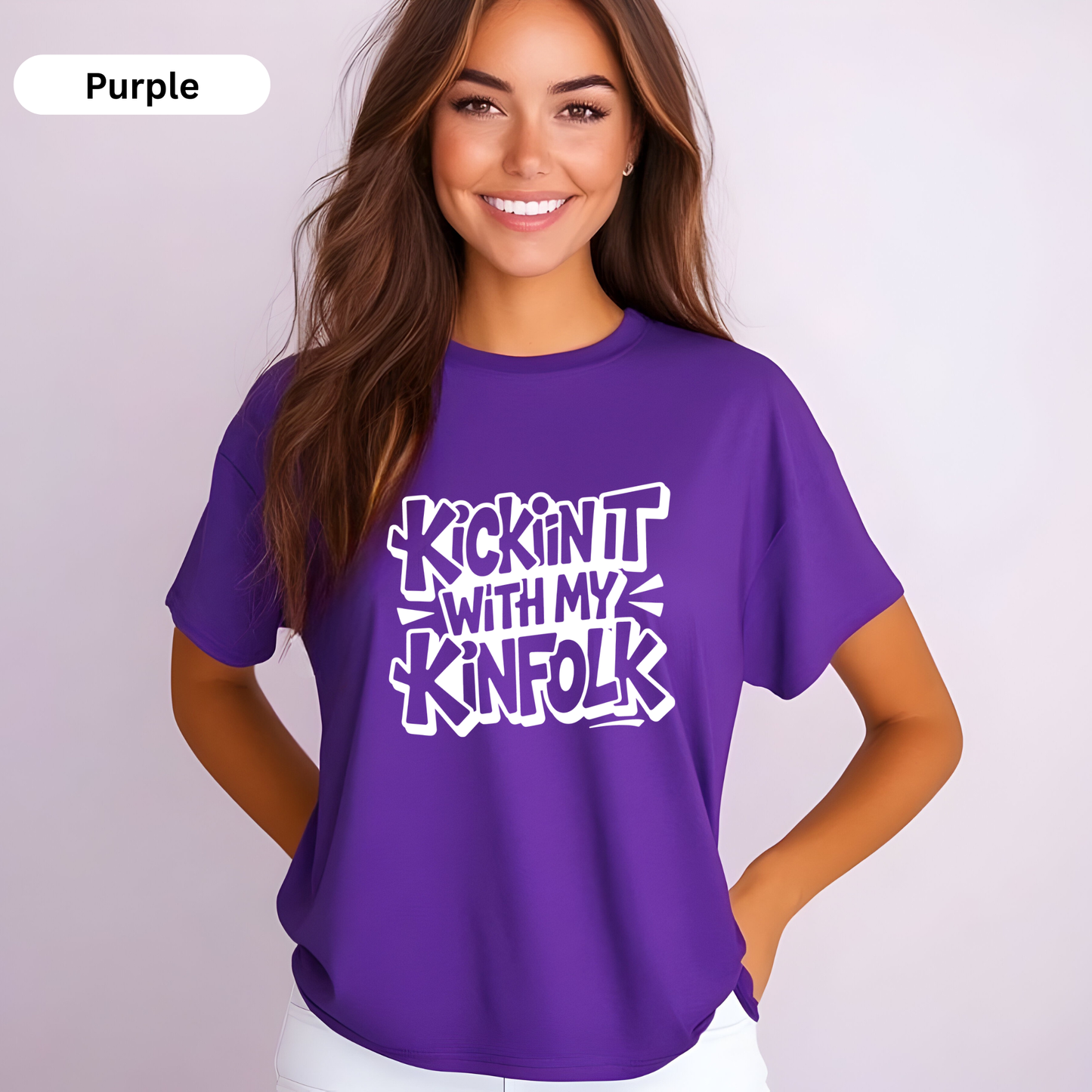Woman wearing a purple t-shirt with text on a plain background