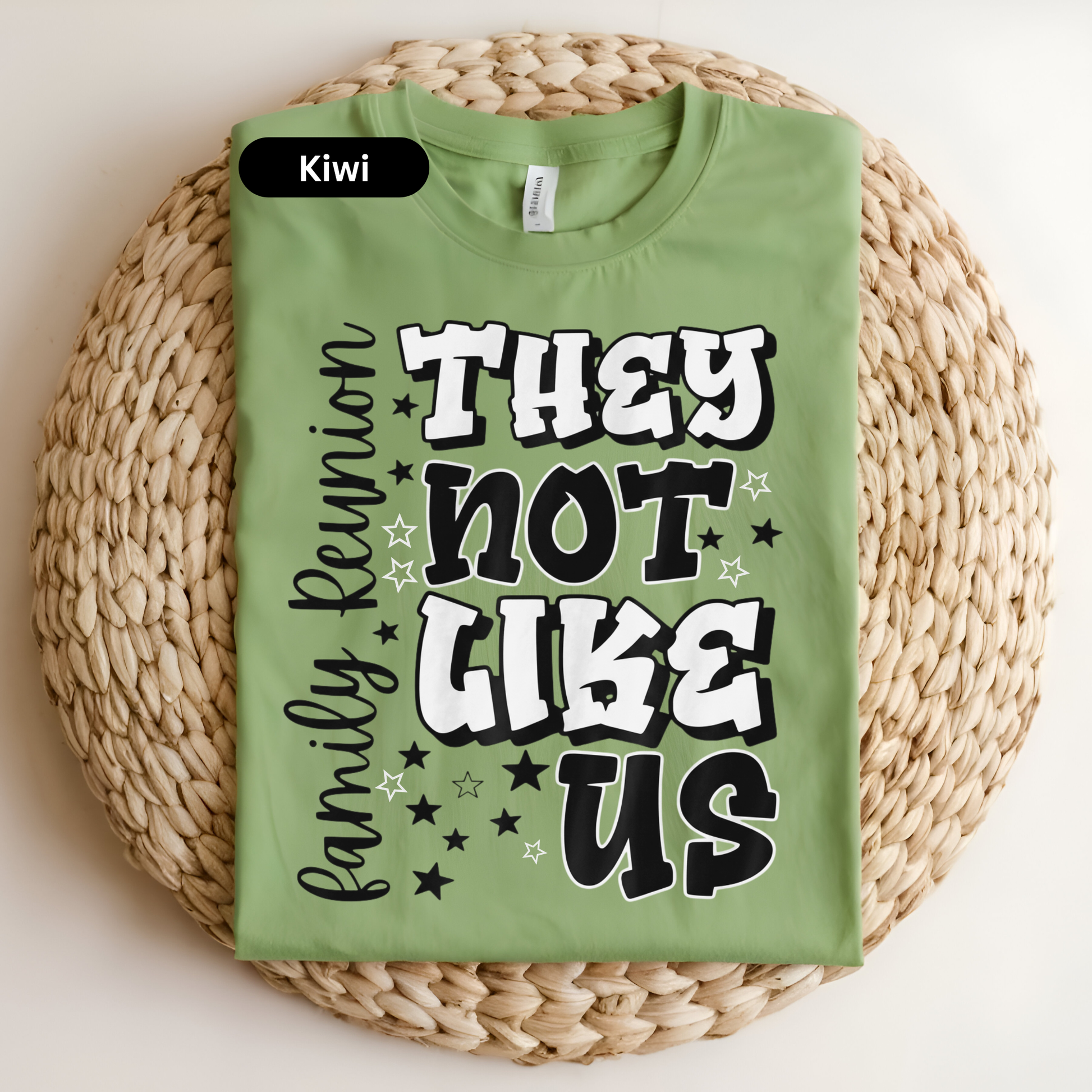 Green t-shirt with text on a woven surface