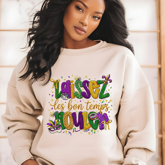 Woman wearing a beige sweatshirt with colorful text design against a light wooden panel background