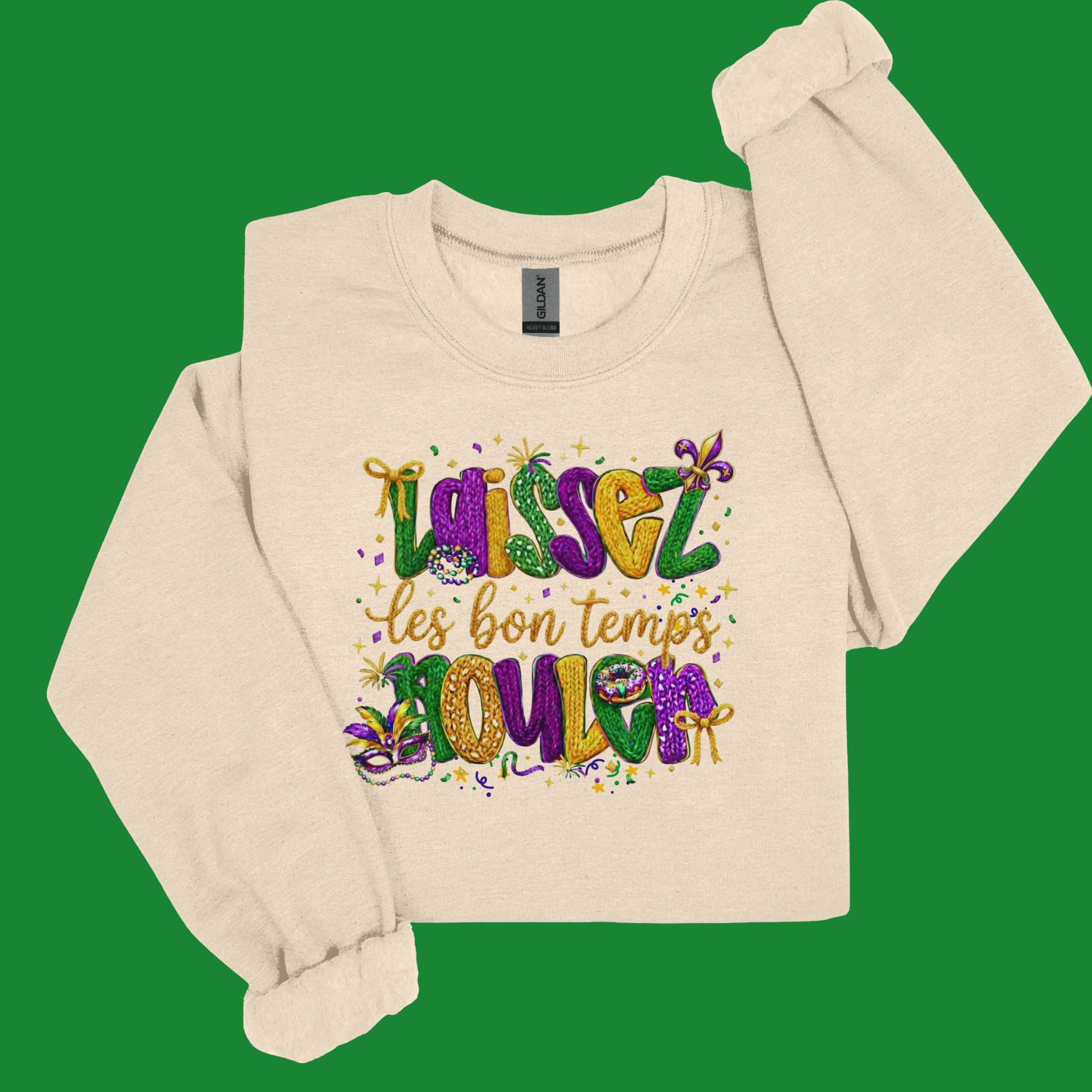 Beige long-sleeve shirt with colorful text design on a green background