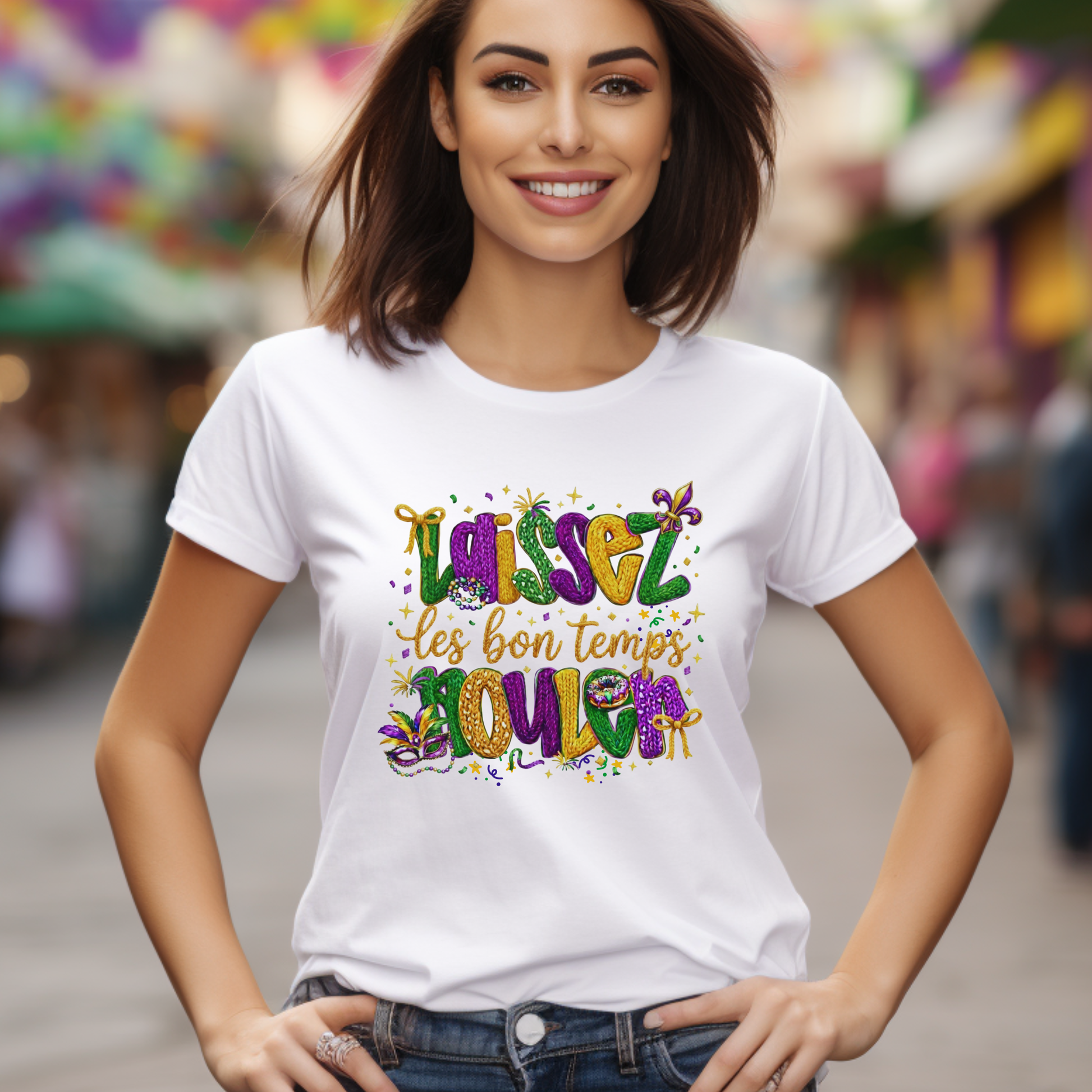 Woman wearing a white t-shirt with colorful text in an outdoor setting