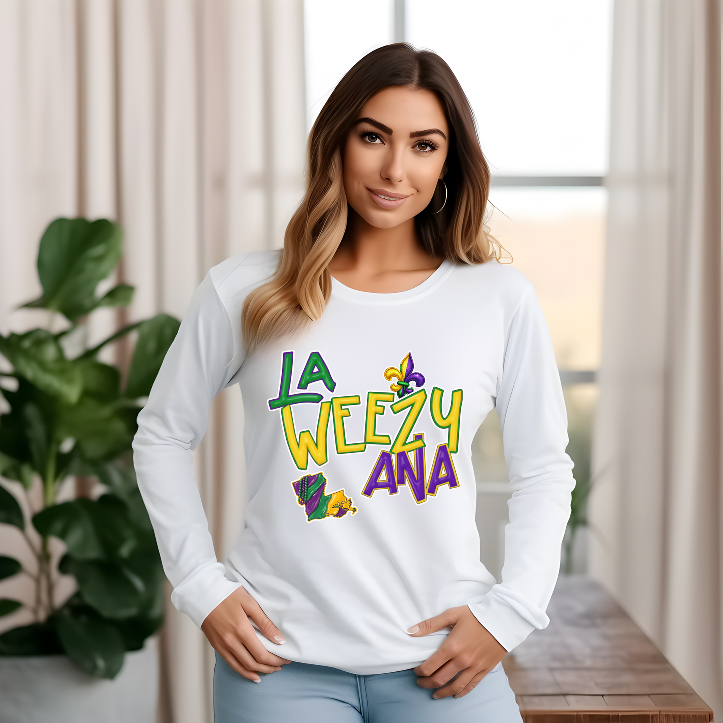 Woman wearing a white long-sleeve shirt with colorful text and graphics indoors.