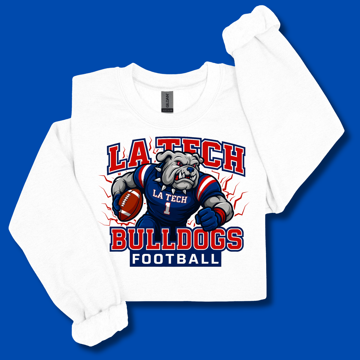 A white long-sleeve t-shirt with a 'LA Tech Bulldogs Football' graphic on the front, featuring a bulldog mascot in a blue and red uniform holding a football, displayed on a solid blue background.