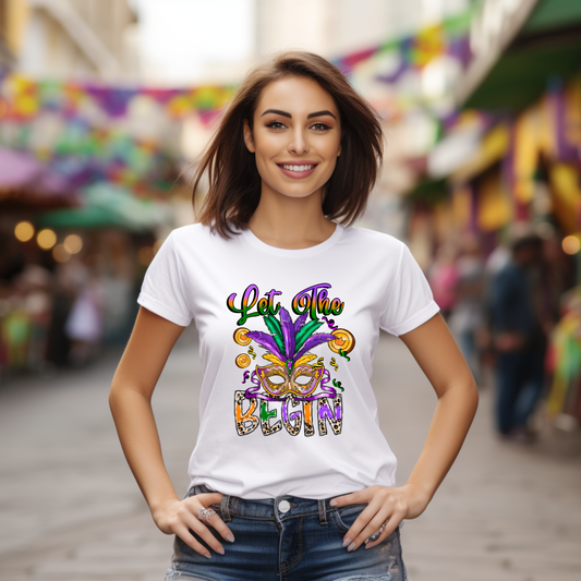 Woman wearing a white t-shirt with colorful text and mask design in a festive setting.
