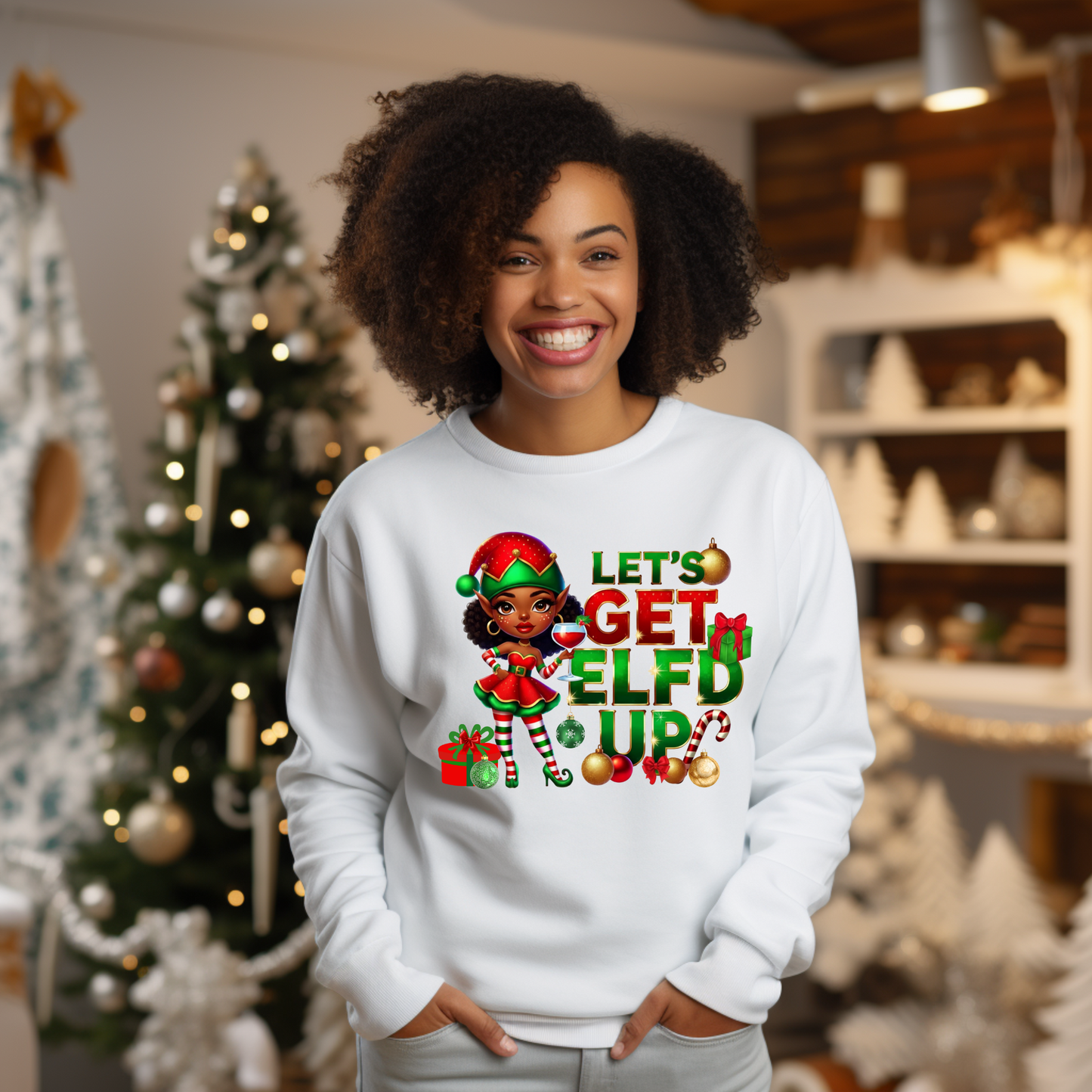Person wearing a white sweatshirt with Christmas-themed design in a festive setting