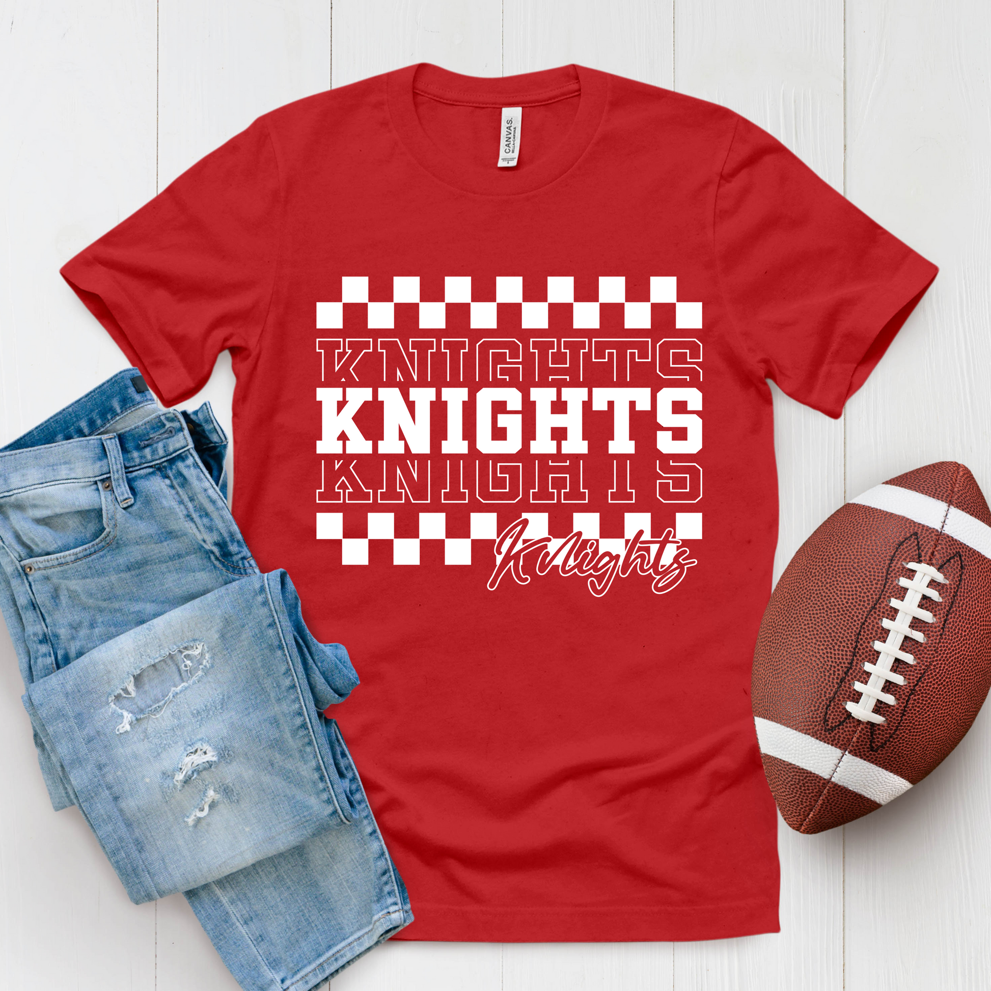 Red t-shirt with 'Knights' text, blue jeans, and football on a white background Knights School Spirit Shirt - Knights Checkered - School Pride T-Shirt