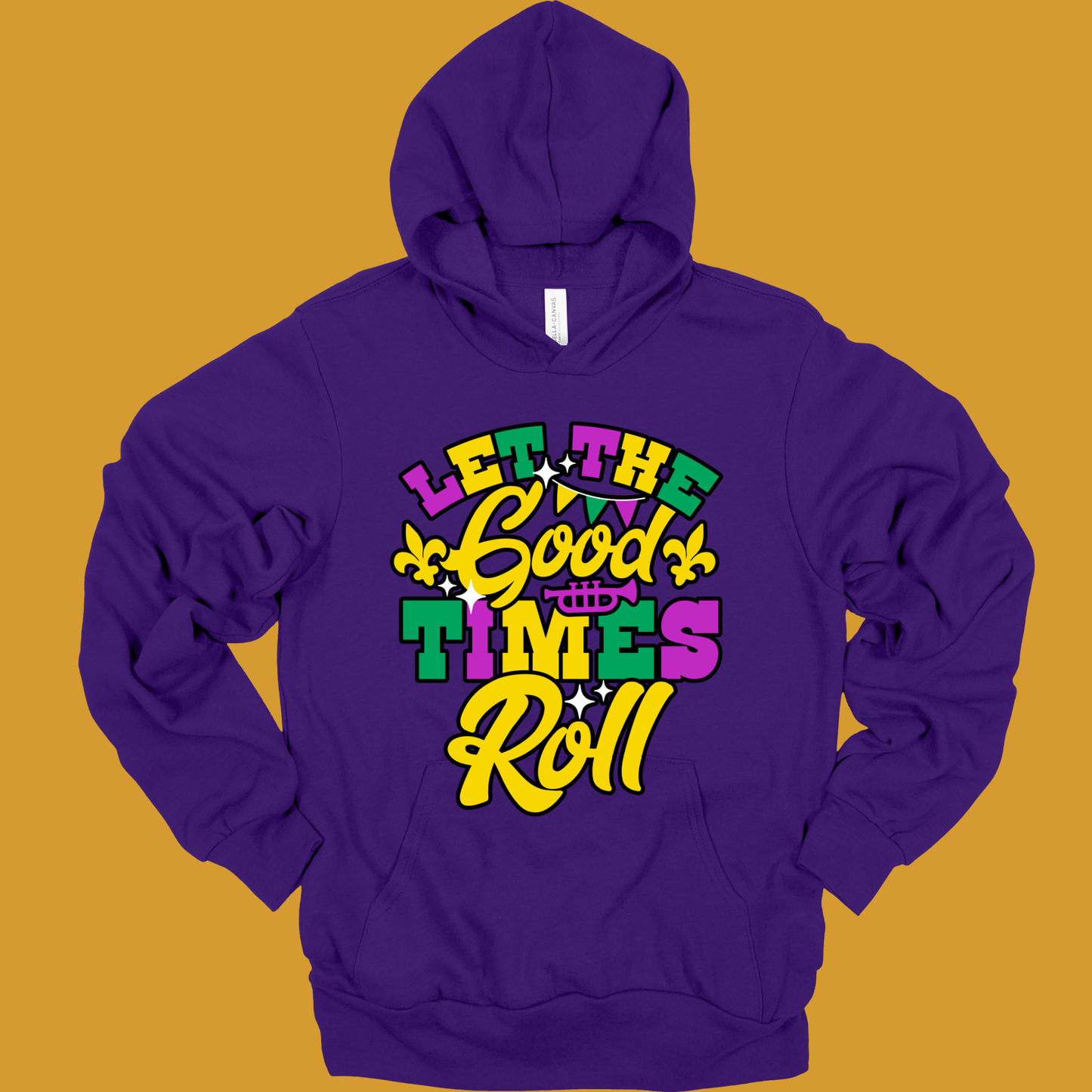 Purple hoodie with colorful text design on a mustard yellow background