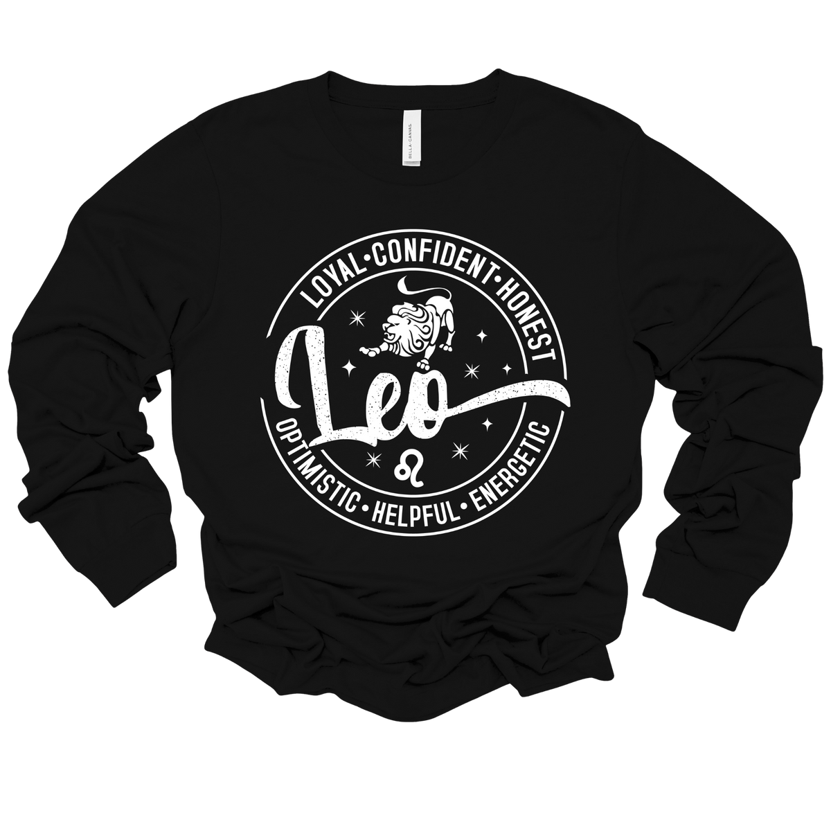 Woman wearing a vibrant black Leo zodiac t-shirt featuring a white round graphic with a lion illustration, the word "Leo," and positive trait keywords like loyal, confident, honest, energetic, helpful, and optimistic.