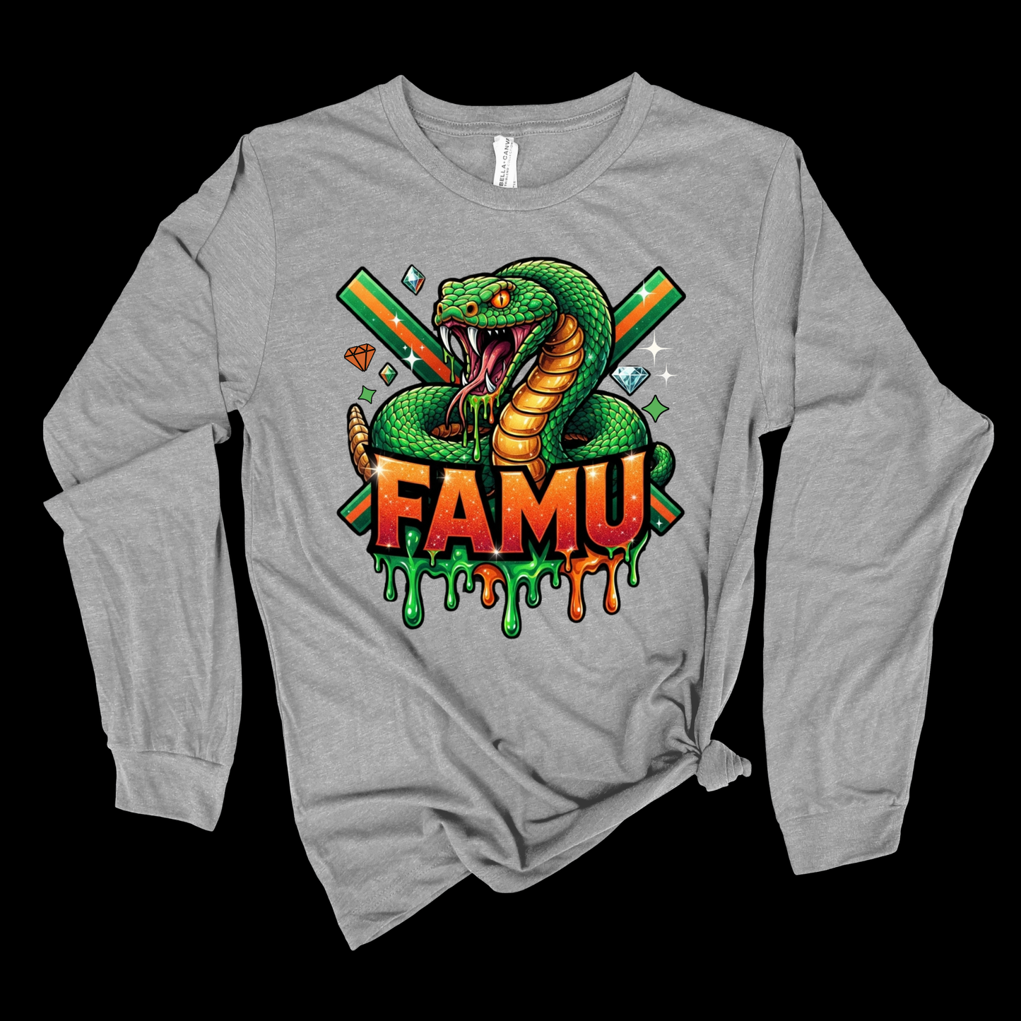 A heather gray long-sleeve t-shirt with a graphic of a green cobra snake and the text 'FAMU' in dripping orange and green letters, displayed against a solid black background.