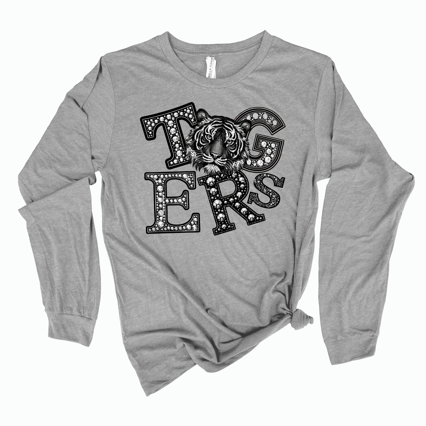 A heather gray long-sleeve t-shirt with a distressed black graphic reading 'TUGS ERS' featuring a tiger design inside the letters, shown on a plain white background.
