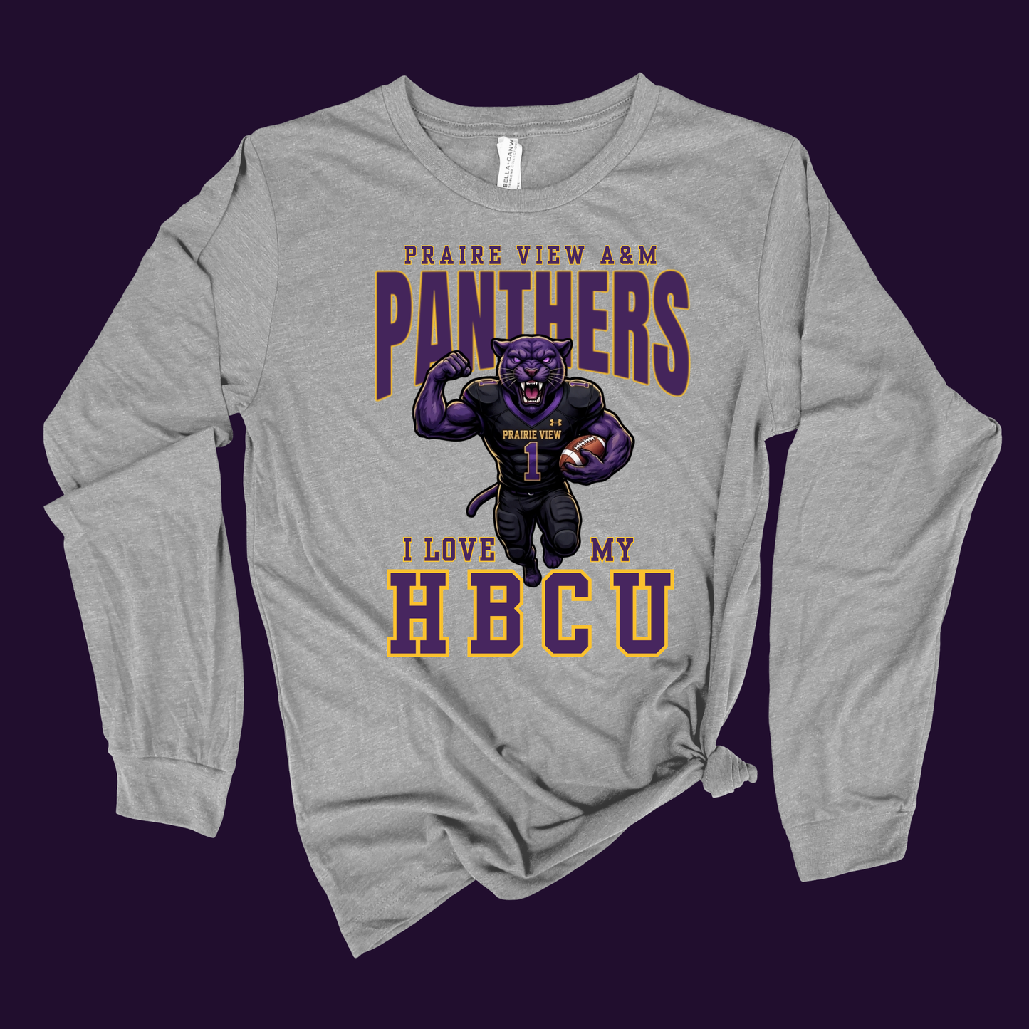 A heather gray long-sleeve t-shirt with a graphic print of a purple panther mascot and the text 'PRAIRE VIEW A&M PANTHERS I LOVE MY HBCU', displayed flat against a dark purple background.