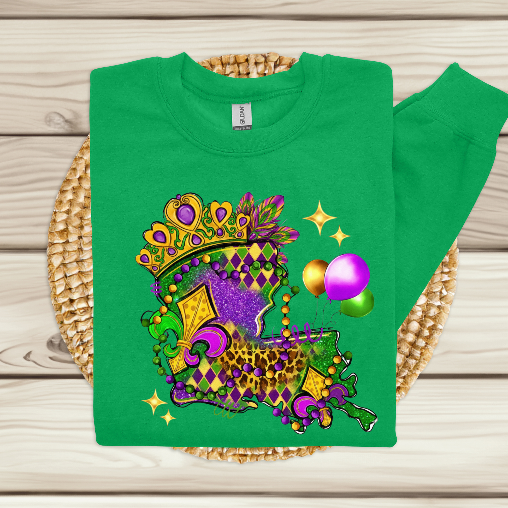 Green t-shirt with Mardi Gras-themed design on a woven mat