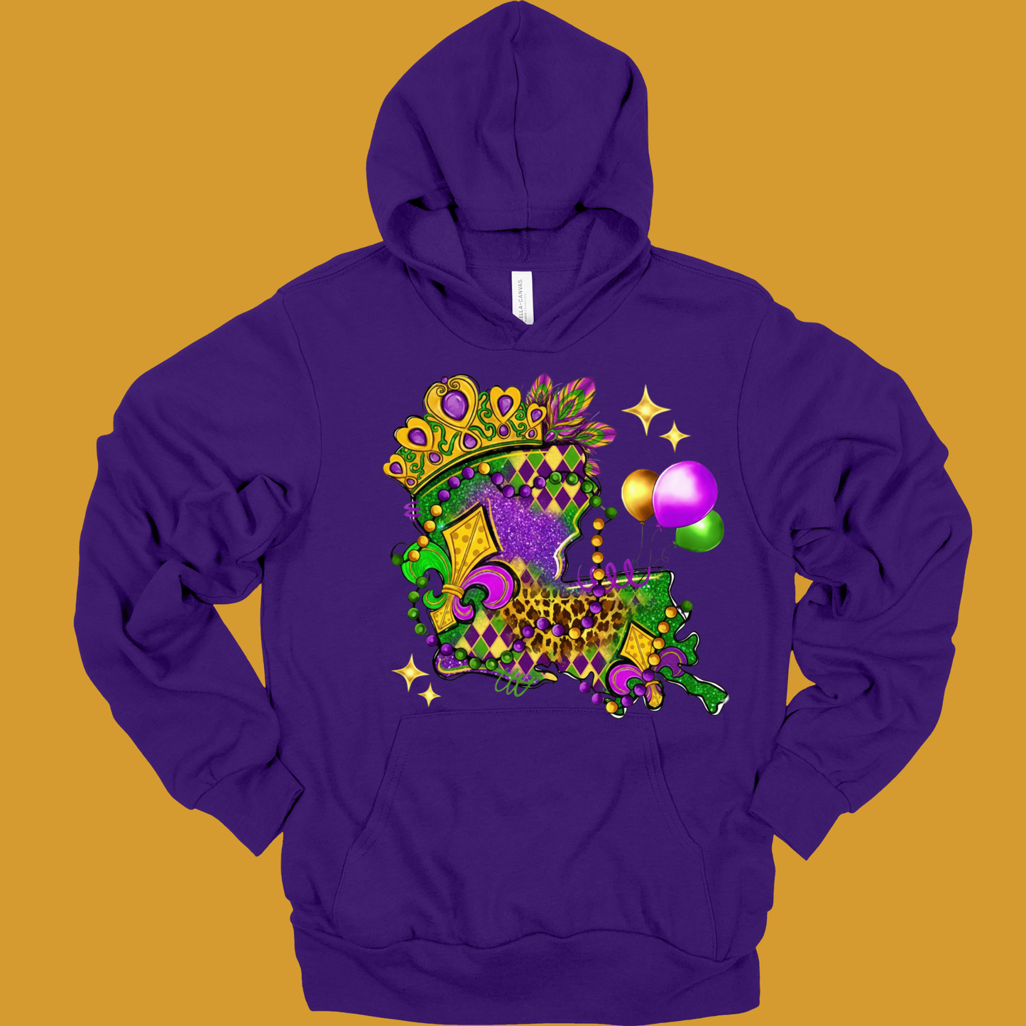 Purple hoodie with a colorful design on a mustard yellow background